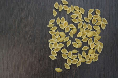 Pasta on dark wooden boardの写真素材