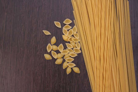 pasta on darck wooden boardの写真素材