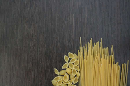 pasta on darck wooden board