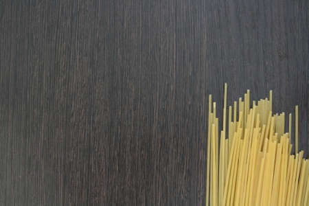 pasta on darck wooden boardの写真素材