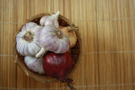 onion and dill in the basketの写真素材