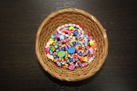 beads on a wooden basketの写真素材