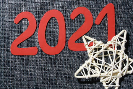Star made of rattan isolated on gray background. New year 2021