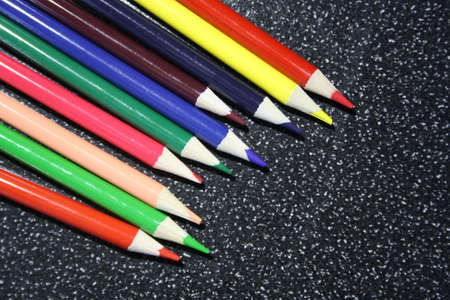 wooden color pencils on a gray backgroundの写真素材