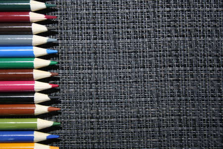 wooden color pencils on a gray backgroundの写真素材