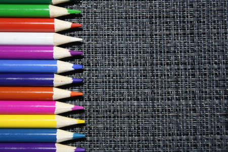 wooden color pencils on a gray backgroundの写真素材