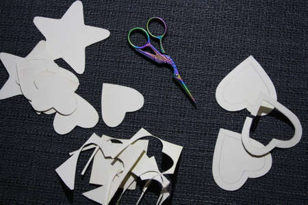Make a star and heart out of cardboard and yarn. Gray backgroundの写真素材