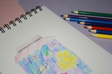 Notebook blank page, colorful pencils. Background with copy spaceの写真素材