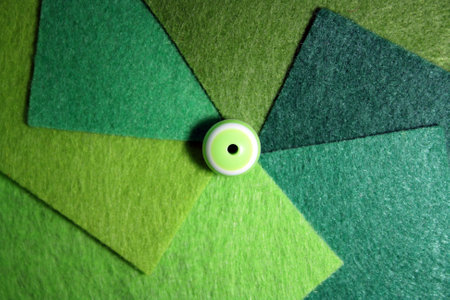 Background from different shades of green felt and geen bead.の写真素材