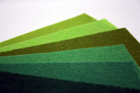 Background from different shades of green felt. Space for text.
