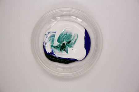 White, green and blue acrylic paints. Space for text.