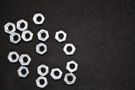 A set of nuts on a black background. Space for text.