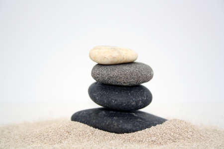 Sea round stones on the fine sand. Selective focus. Space for text.