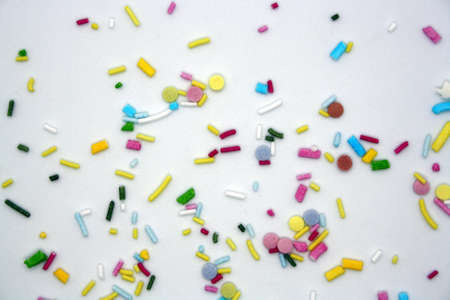 Confectionery multicolored sprinkles on a white background. Space for text.の写真素材