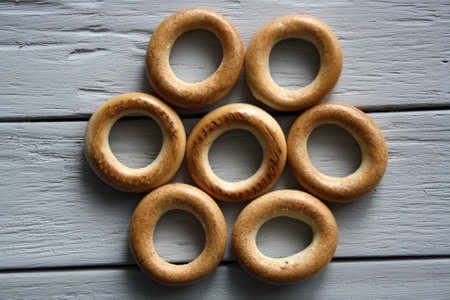 Round drying on a gray wooden surface. Space for text.の写真素材