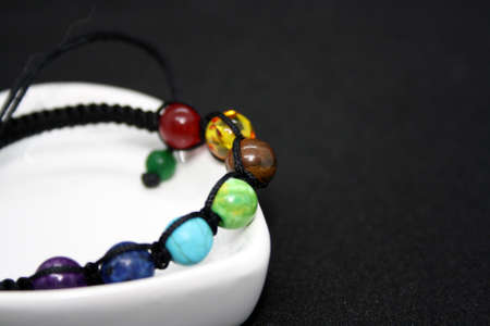 Jewelry on a black background. Bracelet from beads. Space for text.の写真素材