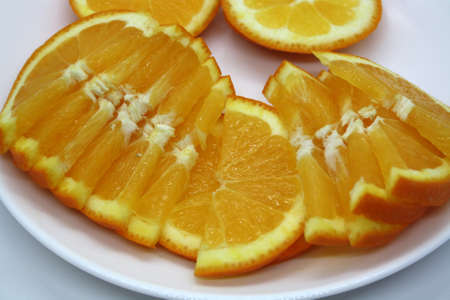 Juicy orange slices on a white background. Vitamin C. Space for text.