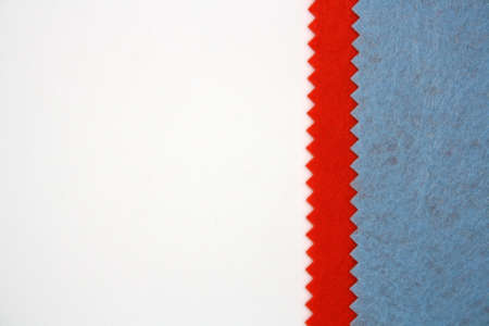 Textile background made of blue and orange felt. Top view. Space for text.の写真素材