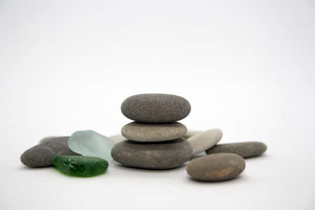 Gray and white sea rocks on a white background. Space for text.の写真素材