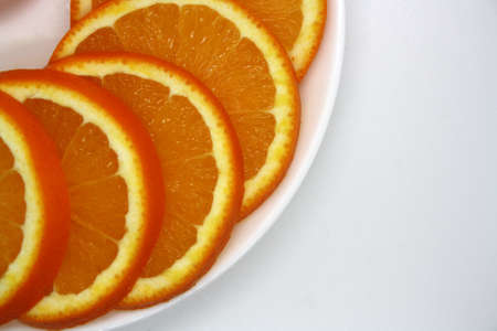 Juicy orange slices on a white background. Vitamin C. Space for text.の写真素材