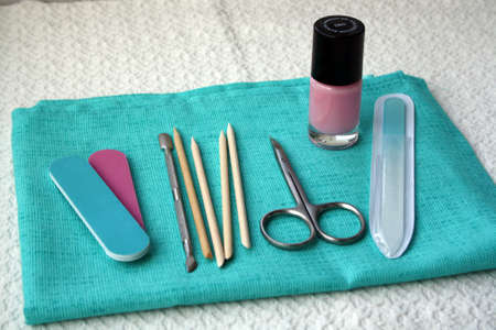 A set of tools for manicure and pedicure on a towel.の写真素材