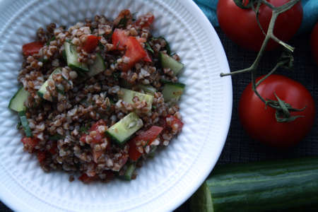 Salad of buckwheat, tomatoes, cucumbers and dill. Space for text.の写真素材