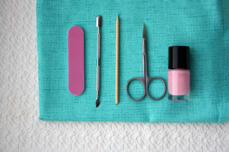 A set of tools for manicure and pedicure on a towel.の写真素材