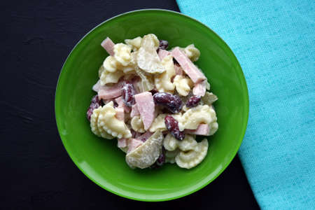 Salad of pasta, ham, beans and pickled cucumbers. Belgian cuisine.の写真素材