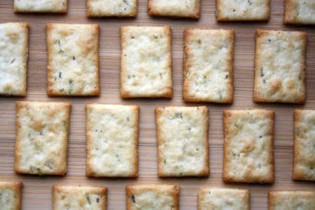 Crackers with rosemary and dill. Culinary background. Space for text.の写真素材