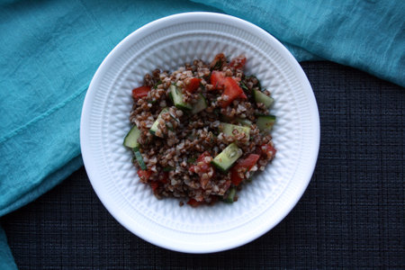 Salad of buckwheat, tomatoes, cucumbers and dill. Space for text.の写真素材