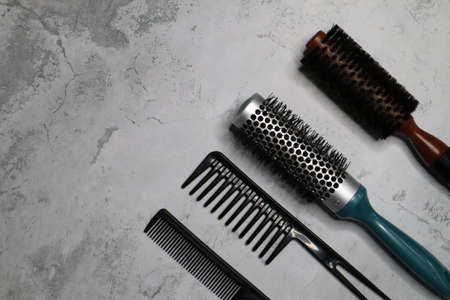 Professional tools for a barber shop on a gray background. Top view. Space for textの写真素材