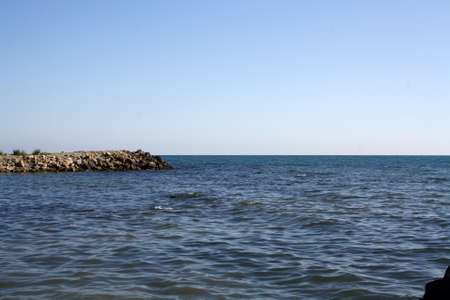 The Black Sea. Beautiful sea horizon and blue water. Rocks. natural photophone. Summerの写真素材