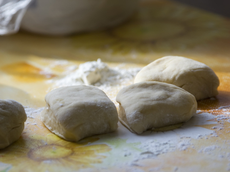 Pieces of dough on the table.の写真素材