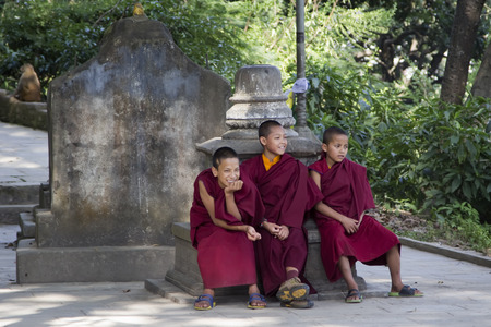 KATHMANDU, NEPAL - NOVEMBER 04 : Stupa Swayambhunath.Young monks resting on a bench. November 06, 2014, in Kathmandu, Nepal.のeditorial素材