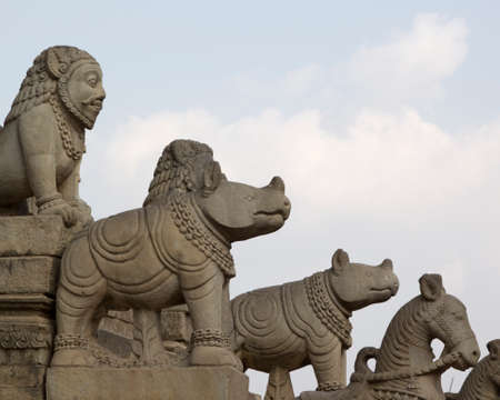 Statues on the steps of an ancient temple in Bhaktapur, Nepal.の写真素材