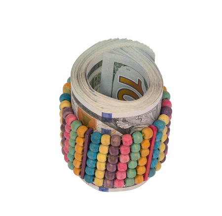 Money in a bracelet on a white backgroundの写真素材