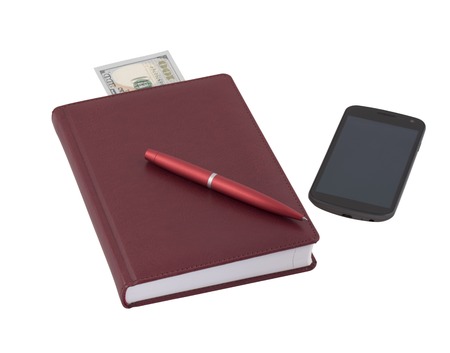 Red notebook and mobile phoneの写真素材