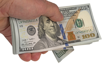Dollars in an arm on a white backgroundの写真素材