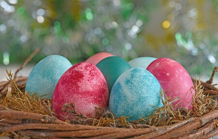 Multi-colored Easter eggs in the nestの写真素材