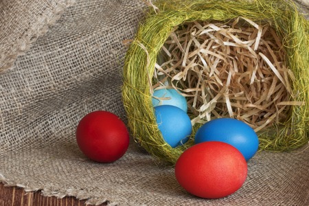 Multi-coloured Easter eggs on desktopの写真素材