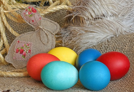 Multi-coloured Easter eggs on desktopの写真素材