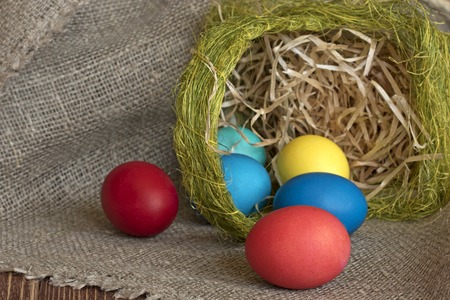 Multi-coloured Easter eggs on desktopの写真素材