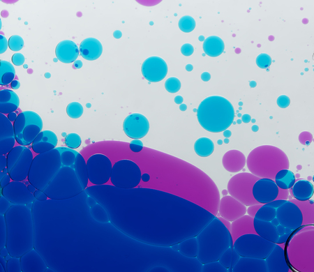 Circles from a multi-coloured liquidの写真素材
