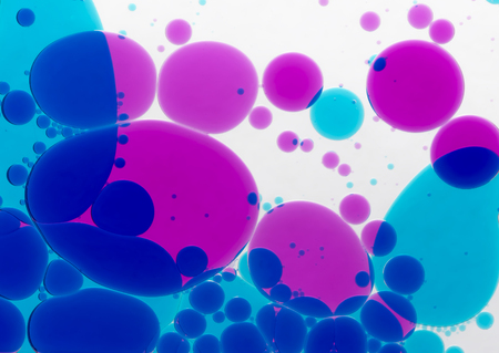 Circles from a multi-coloured liquidの写真素材