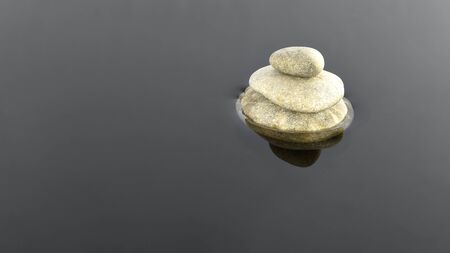 three stones on the waterの写真素材