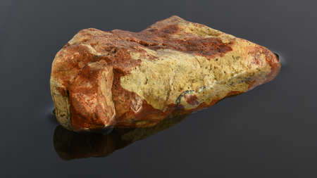 multicolored stone in the water halfの写真素材