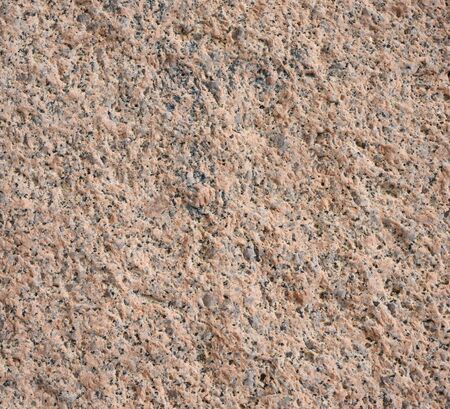 Background of the surface of the stone on the sea shoreの写真素材