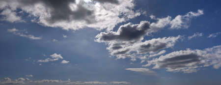 White and gray clouds in the blue skyの写真素材