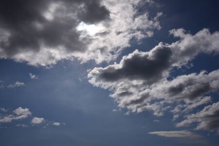 White and gray clouds in the blue skyの写真素材