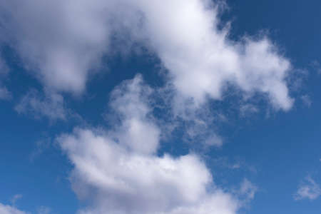 White and gray clouds in the blue skyの写真素材